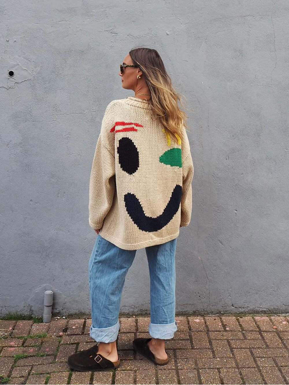 Women's sweater with playful face motif – knitted sweater in artistic style for leisure & everyday use