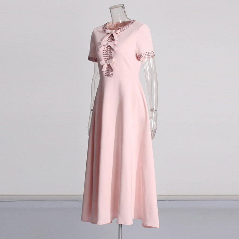 Helen – High-waisted dress with round neckline and rhinestone bow