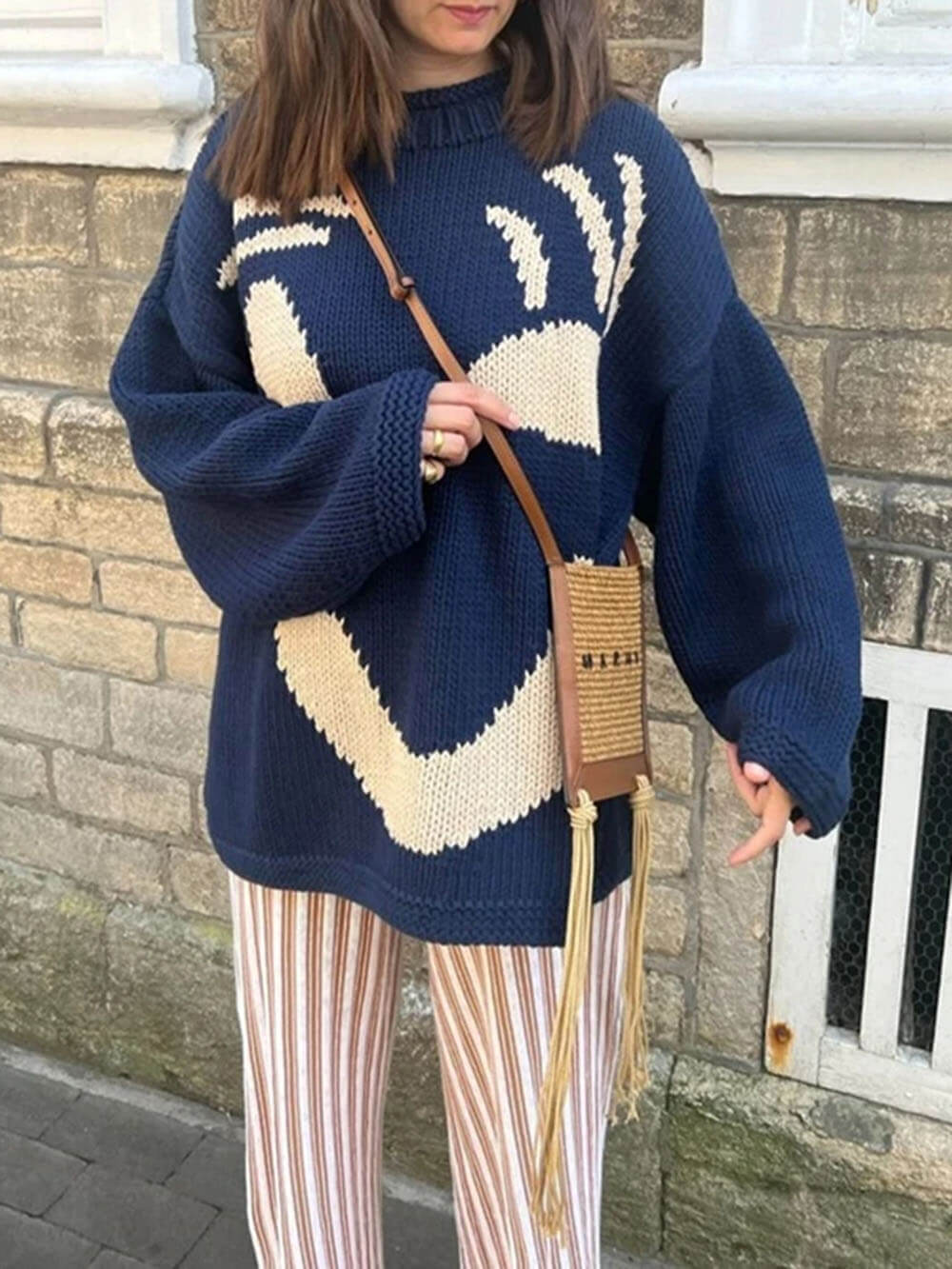 Women's sweater with playful face motif – knitted sweater in artistic style for leisure & everyday use