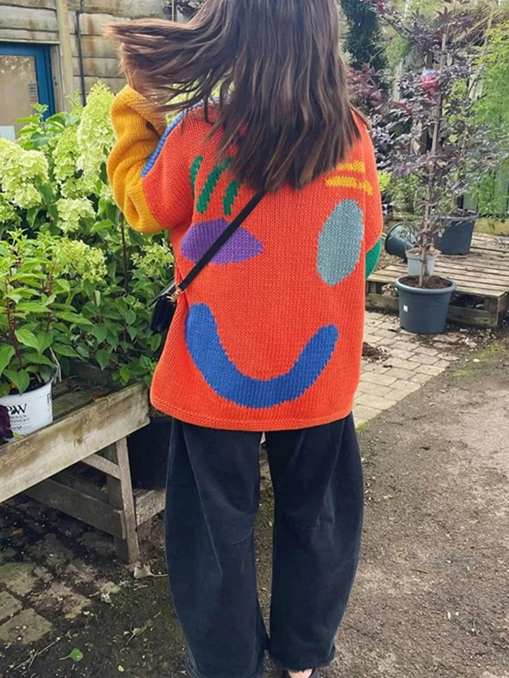 Women's sweater with playful face motif – knitted sweater in artistic style for leisure & everyday use