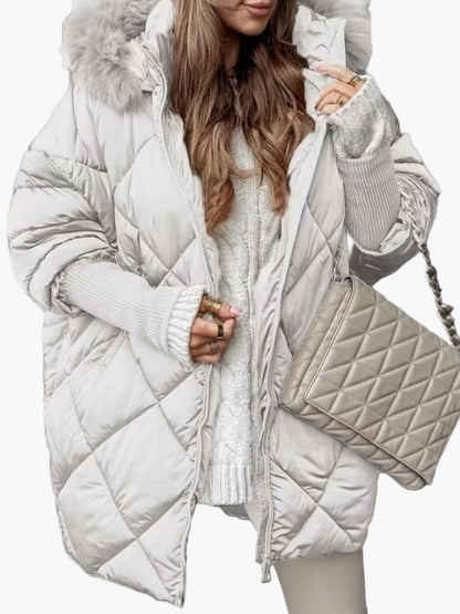 Women's winter quilted jacket with hood and oversize look – fashionable outdoor jacket for cold days